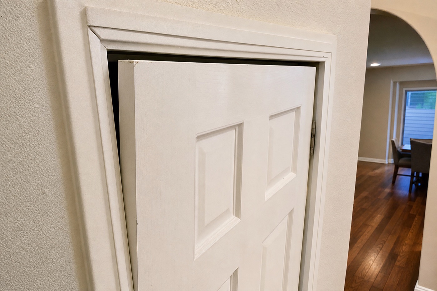 Interior wooden door and frame in a Texas home — sticking doors often signal foundation-related frame distortion