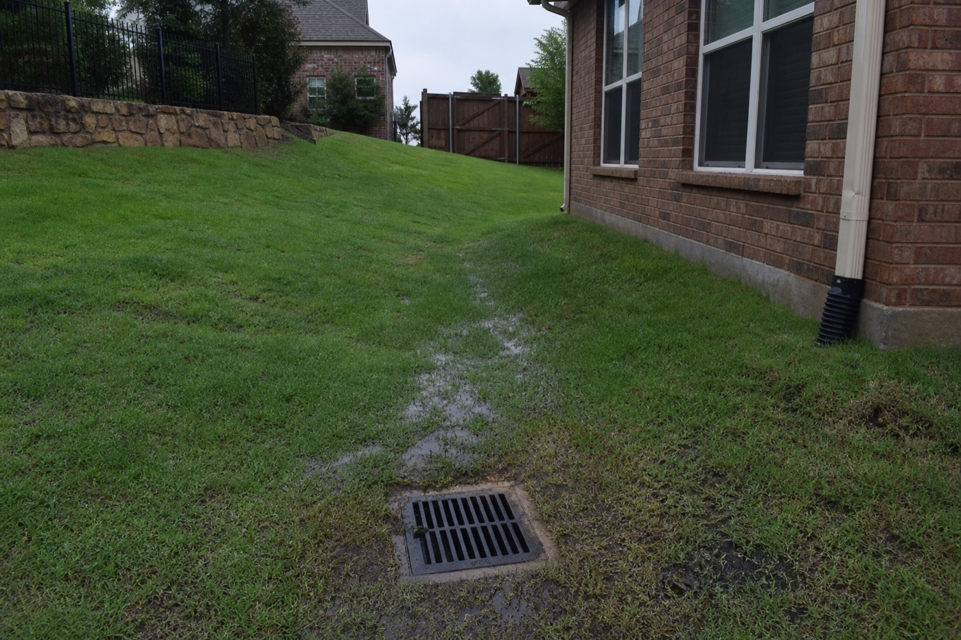 North Texas suburban home with graded yard — proper drainage helps protect foundations on clay soil